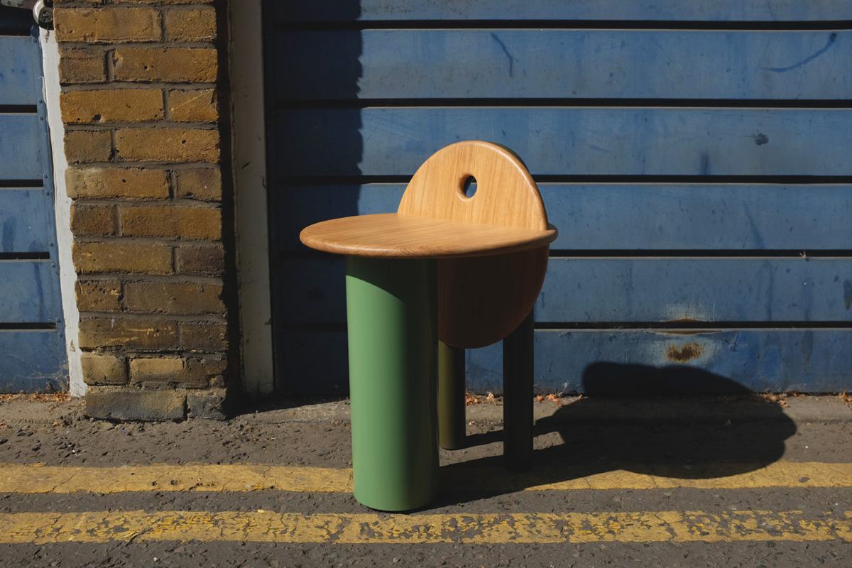 Workshop Stool against a blue corrugated door on a London street