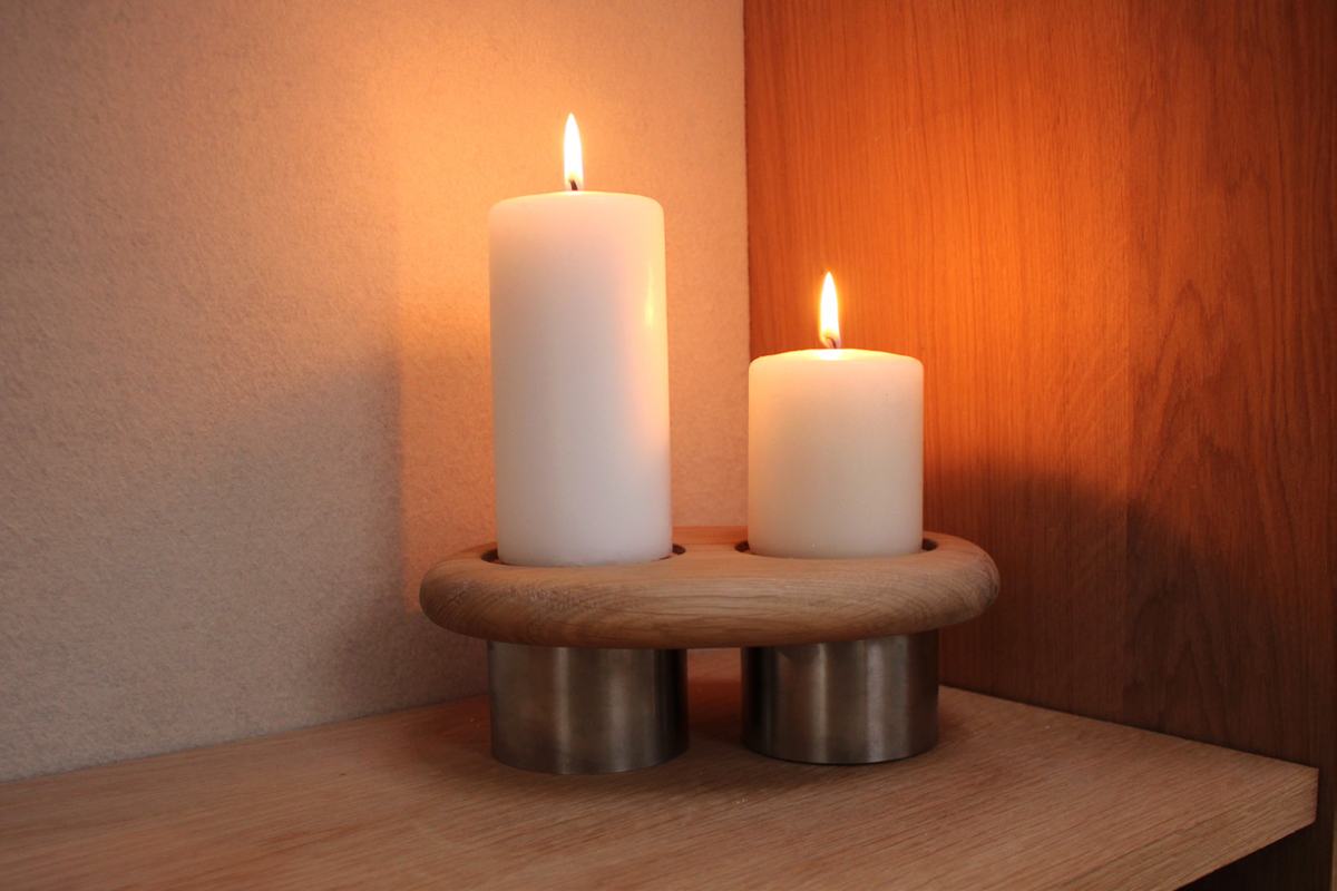 Twin holder lit in a warm corner