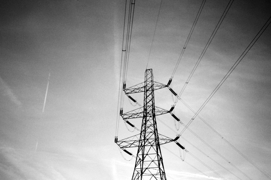 Transmission tower pylon against an evening sky, cables fanning out